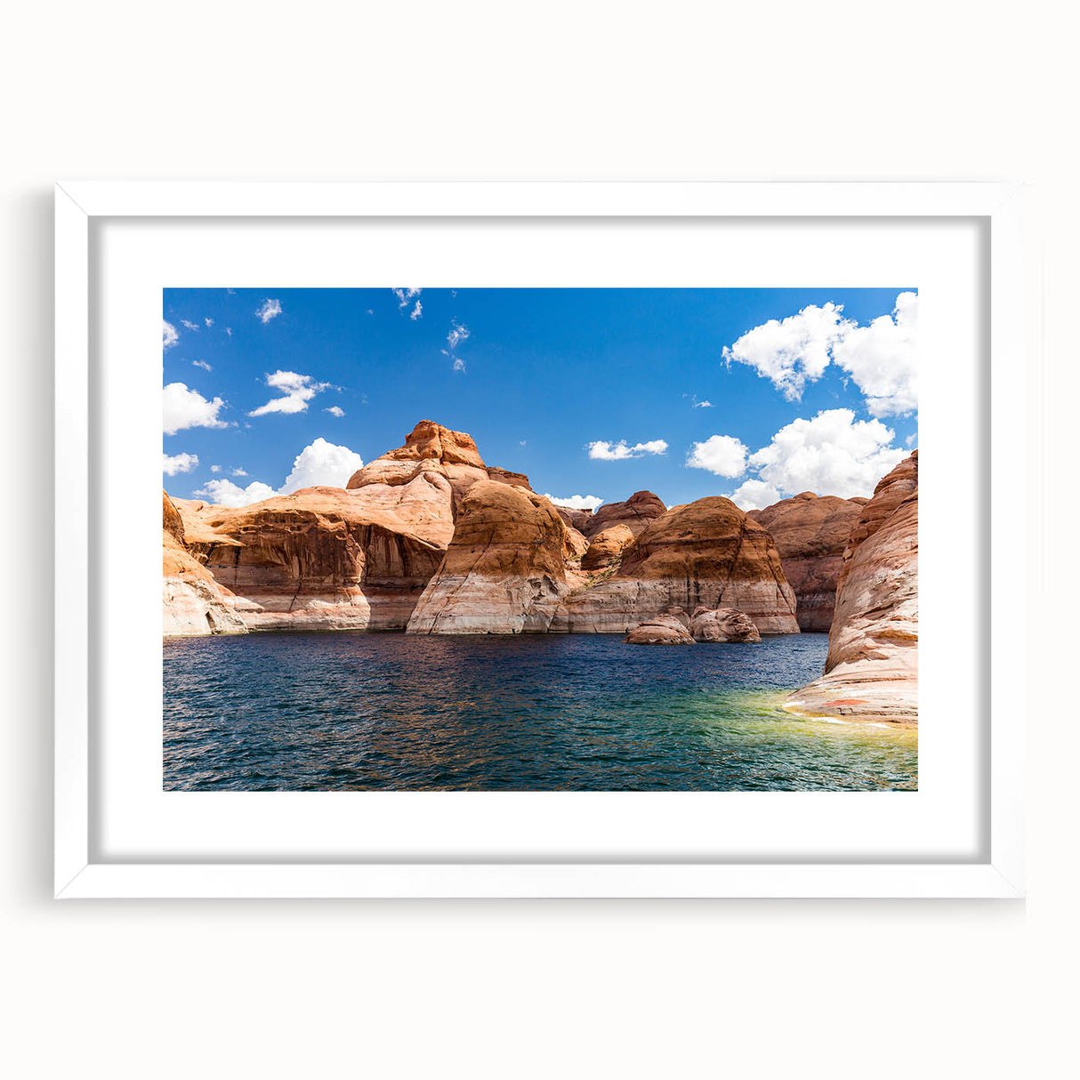 Abstract art print of Lake Powell in muted blue and peach tones, framed with a white mat, ideal for dining room decor.