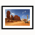 Extra large textured abstract print of Monument Valley in vibrant colors, framed in black, ideal for living room decor.