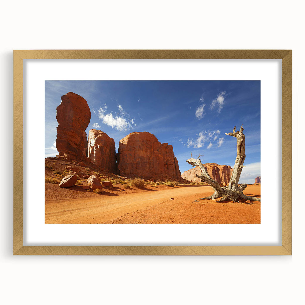 Extra large textured art print of Monument Valley with vibrant red and orange hues on a gold-framed canvas.