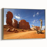 Framed canvas featuring a vintage-style landscape painting of Monument Valley in black and gold tones.