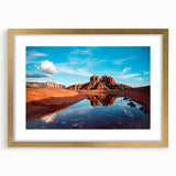 Extra large abstract art print of Sedona landscape in muted earth tones on a textured canvas, framed in gold.