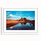 Abstract art print of Sedona landscape in muted earth tones on a white-framed canvas.