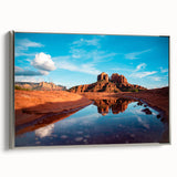 Framed canvas featuring a Sedona landscape in vibrant red and orange tones, ideal for adding color to a neutral room.