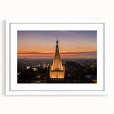 Abstract art print of Berkeley, California in muted blue and green tones on a white framed mat, ideal for dining room decor.