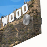 Large abstract wall art depicting the Hollywood skyline in muted gray and blue tones on acrylic glass.