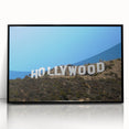 Large abstract wall art depicting the Hollywood, California skyline in muted gray tones, framed in black acrylic.