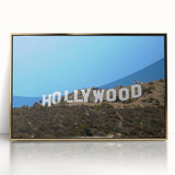 Large art print of the Hollywood, California skyline in gold and black tones on framed acrylic.