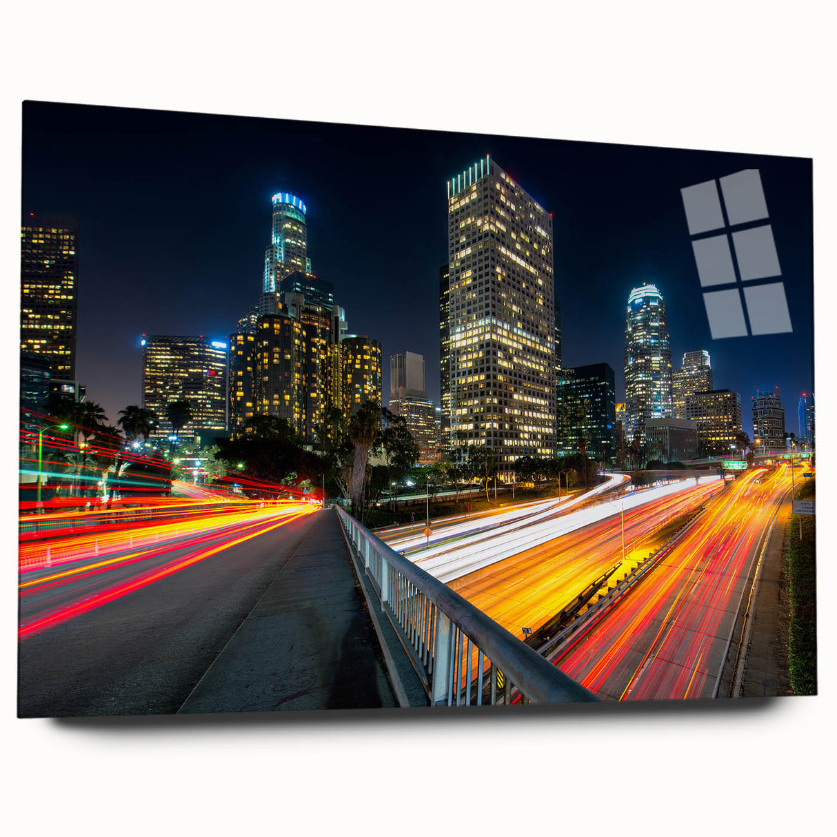 Large abstract depiction of Los Angeles skyline in muted gray and blue tones on acrylic glass.