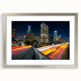 Textured abstract art print of Los Angeles skyline in muted silver and gray tones on a framed canvas.