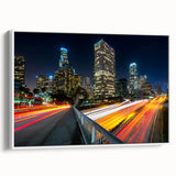 Vintage poster art of Los Angeles skyline in vibrant colors on a large framed canvas, ideal for living room decor.