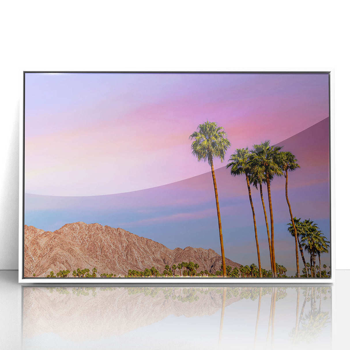 Art deco style poster of Palm Springs with pastel pink and blue tones, framed in white acrylic.