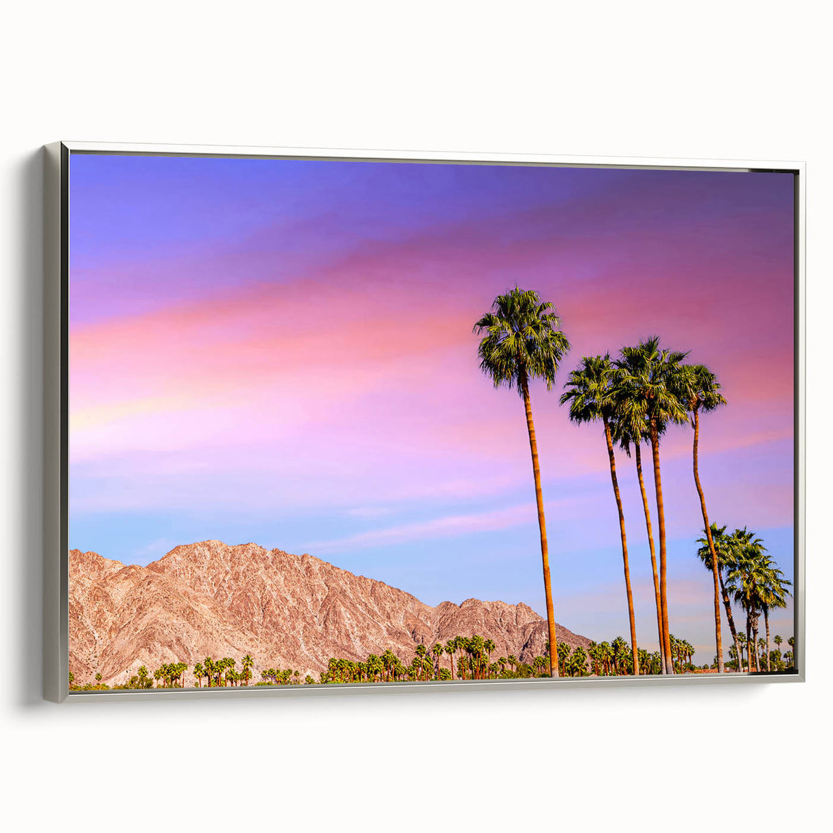 Landscape art painting of Palm Springs with colorful vintage poster art style on a black background, framed in silver canvas.