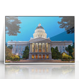 Art Deco style poster of Sacramento skyline in muted gray and blue tones, acrylic print framed in white.