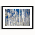 Extra large abstract art print depicting colorful, textured scenery of Aspen, Colorado, in a black frame with mat.