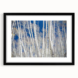 Extra large abstract art print depicting colorful, textured scenery of Aspen, Colorado, in a black frame with mat.