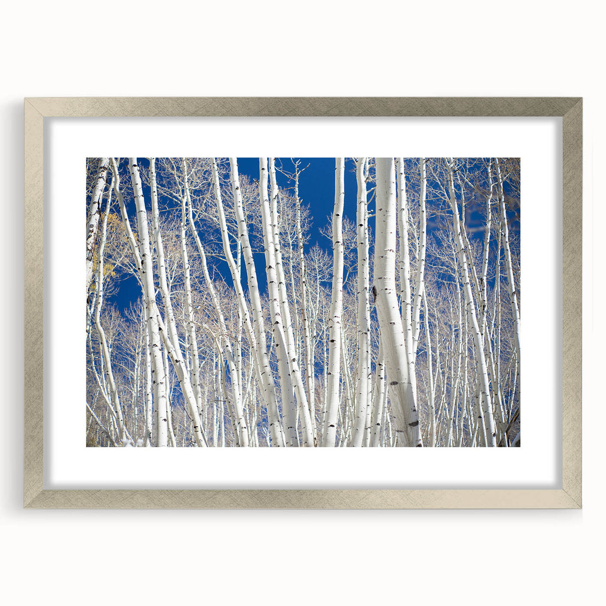 Textured abstract art print of Aspen, Colorado, in silver frame, featuring earthy tones, ideal for bedroom wall decor.