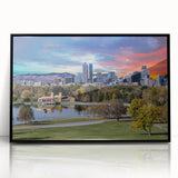 Large abstract wall art depicting a stylized Denver skyline in muted gray and blue tones on a framed acrylic panel.