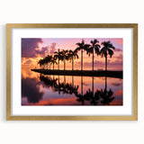 Extra large abstract art print of Miami skyline in vibrant blue and pink, framed in gold, ideal for living room decor.