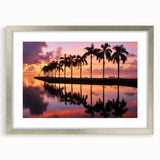 Textured art print of abstract Miami scenery in muted blue and gray, framed in silver, ideal for bedroom ambiance.