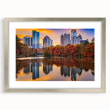 Textured abstract art print of Atlanta skyline in muted gray and blue tones on a framed silver canvas.