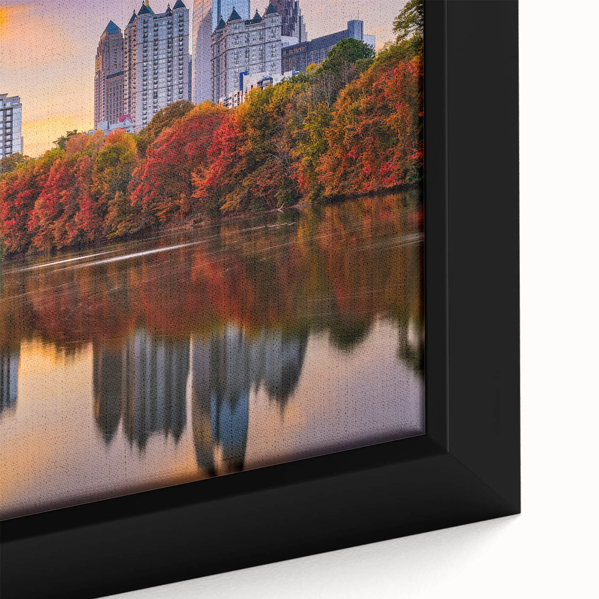 Framed canvas of the Atlanta skyline in black with colorful, textured details, ideal for large living room walls.
