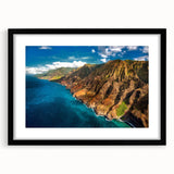 Abstract art print of a colorful Kauai landscape on textured canvas, framed in black, ideal for living room decor.