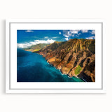 Abstract art print of Kauai landscape in muted green and blue tones, framed in white, ideal for dining room decor.