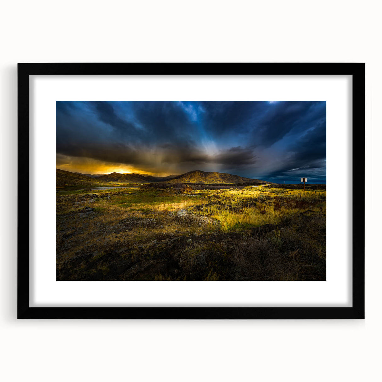 Abstract art print featuring textured, colorful swirls on a large canvas, framed in black, ideal for living room decor.