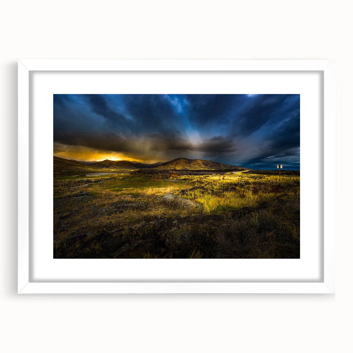 Abstract art print of Idaho scenery in muted earth tones, framed with a white mat, ideal for dining room decor.