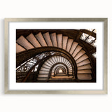 Textured art depicting an abstract Chicago skyline in muted blue and gray tones on a framed silver mat.