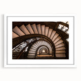 Abstract art print of Chicago skyline in muted blue and gray tones on a framed white canvas, suitable for dining room decor.