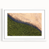 Abstract art print of Iowa scenery in muted earth tones, framed with a white mat, suitable for dining room decor.