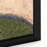 Close-up of textured black wall art featuring a colorful Iowa scenery on a framed canvas, ideal for living room decor.