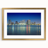Extra large abstract art print of New Orleans scenery in gold frame, featuring textured design in vibrant colors.