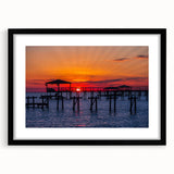 Colorful abstract art print of Louisiana scenery in vibrant hues on a large textured canvas, framed in black.