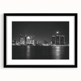 Abstract art print of Detroit skyline in vibrant colors on a large framed canvas, suitable for living room decor.