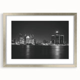 Textured abstract art print of Detroit skyline in muted metallic tones, framed in silver, ideal for bedroom decor.