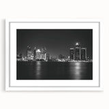 Abstract art print of Detroit skyline in muted gray and blue tones on a framed white mat, ideal for dining room decor.