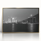 Acrylic print of Detroit skyline in muted gold and gray tones, framed, in mid-century modernist style.