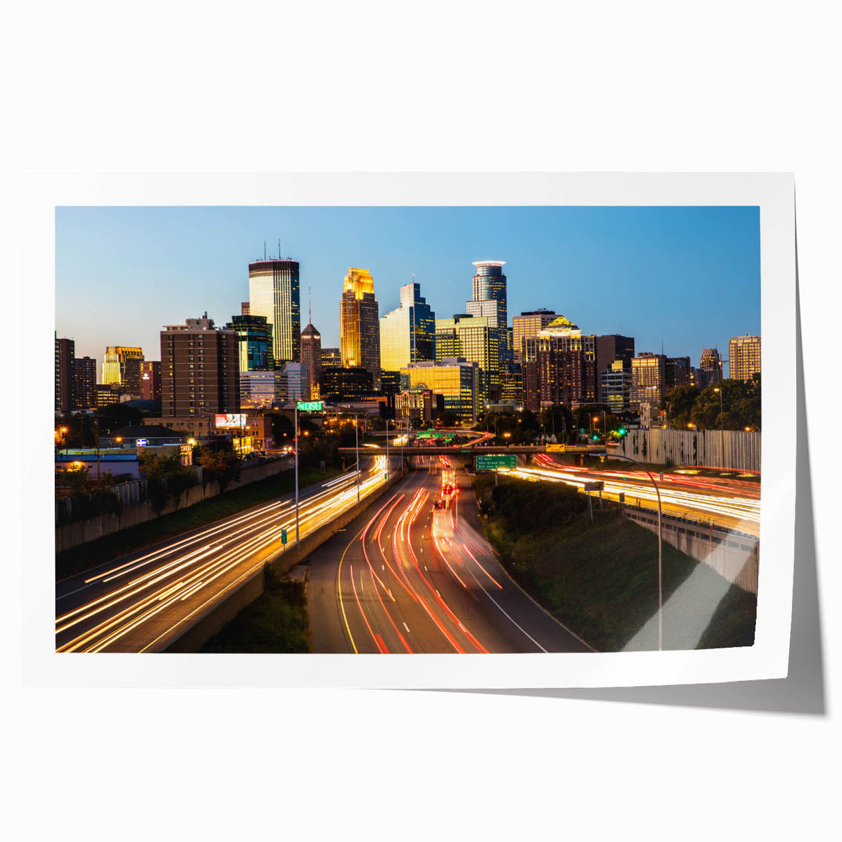 Rolled canvas print of Minneapolis skyline in muted blue and gray tones, suited for dining room wall art.