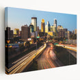 Side view of a stretched canvas featuring a detailed Minneapolis skyline in muted blue and gray tones.