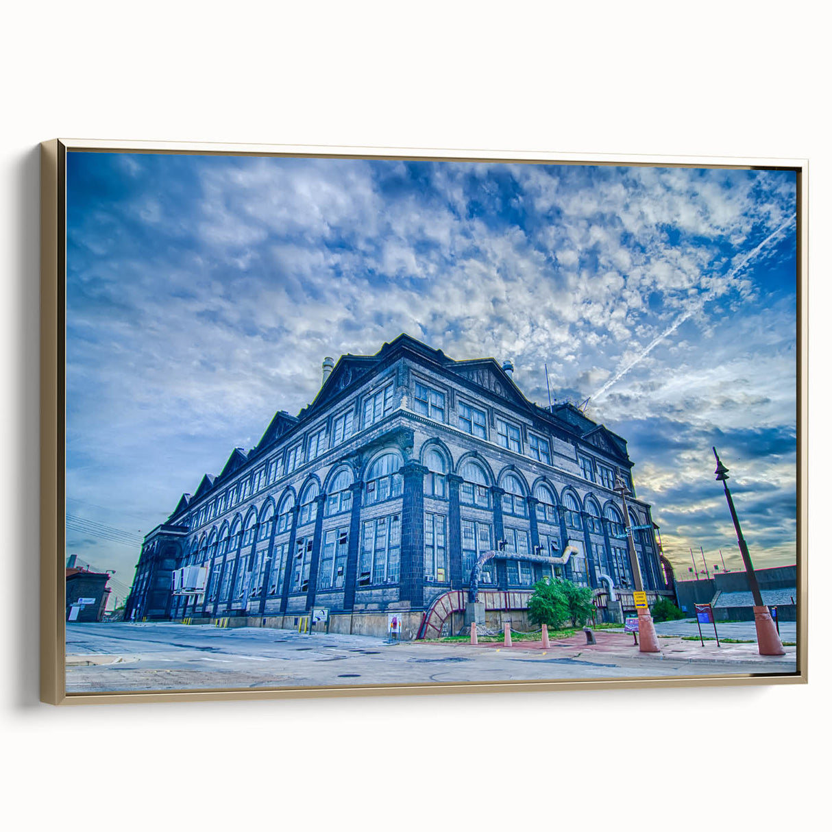 Framed canvas of St. Louis skyline in gold and black, ideal for adding a vintage touch to office spaces.