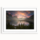 Abstract art print of Glacier National Park in muted blue and green tones, framed with a white mat.