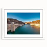 Abstract art print of Hoover Dam in muted gray and blue tones, framed with a white mat, suitable for dining room decor.