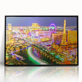 Large abstract wall art depicting the Las Vegas skyline in vivid neon colors on a black acrylic framed print.