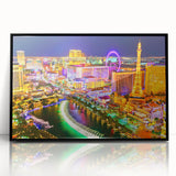 Large abstract wall art depicting the Las Vegas skyline in vivid neon colors on a black acrylic framed print.