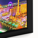 Extra large framed canvas of Las Vegas skyline in black with colorful, textured highlights, ideal for living room decor.
