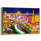Framed canvas depicting the Las Vegas skyline in vintage poster style, featuring a black and gold color palette.