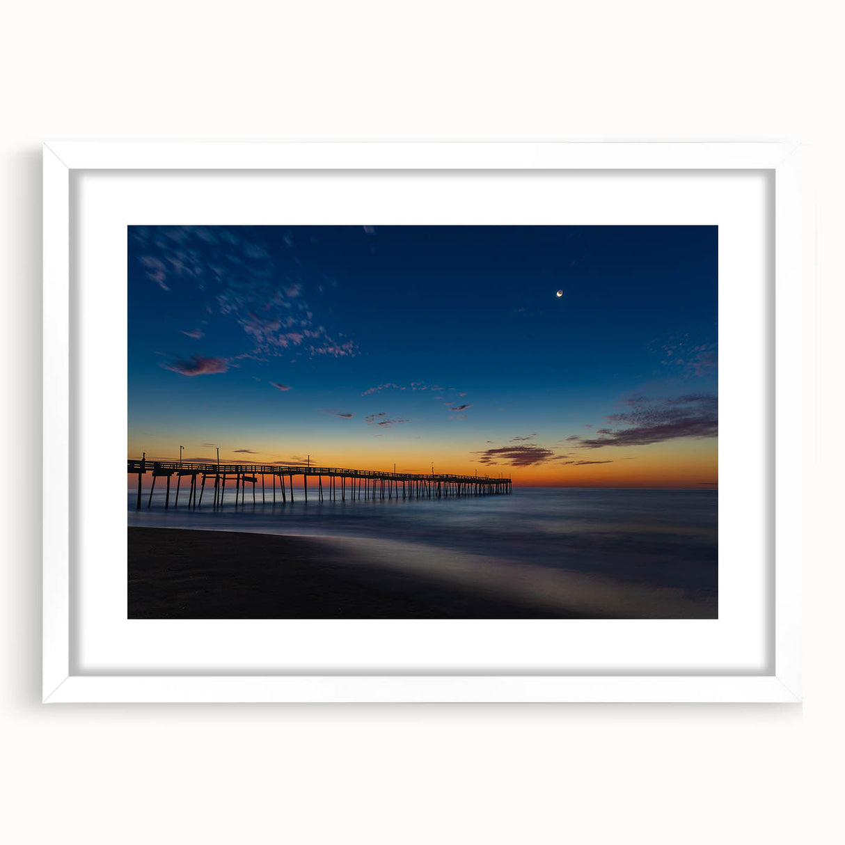 Abstract art print of Cape Hatteras with muted blue and green tones on a white framed canvas, suitable for dining room decor.