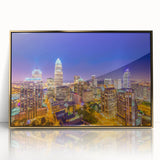 Framed acrylic print of Charlotte, North Carolina skyline in muted gold and blue tones, suitable for modern art wall decor.